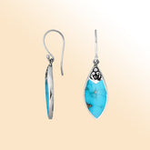 Handcrafted sterling silver marquise drop earrings with vibrant turquoise shell and Balinese scrollwork design